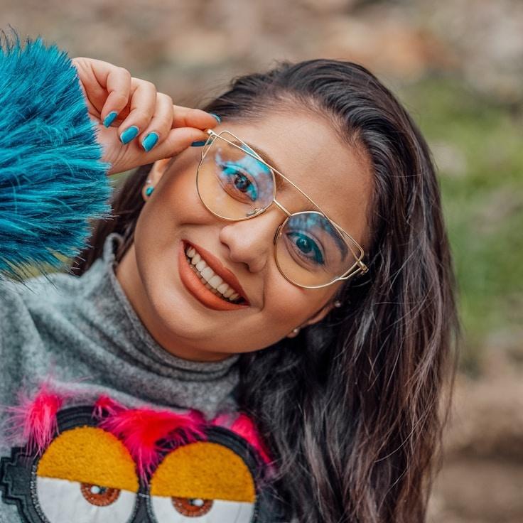 Kaveri Mehta, Lead Design Curator at Silver Moon Pathway, reviewing corporate floral arrangements